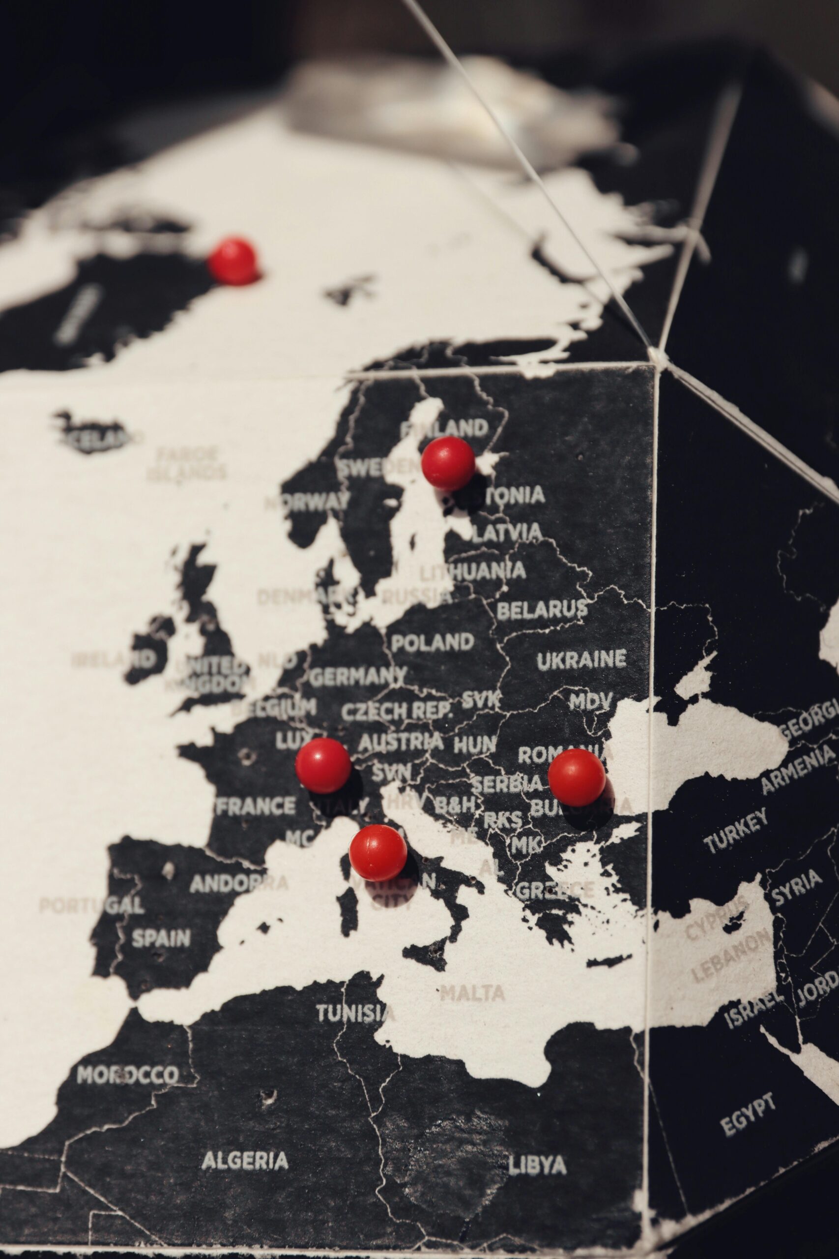 Detailed map of Europe with red pins marking major locations. Ideal for travel and cartography themes.